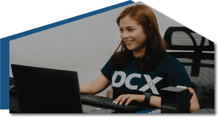 DCX team member working at computer